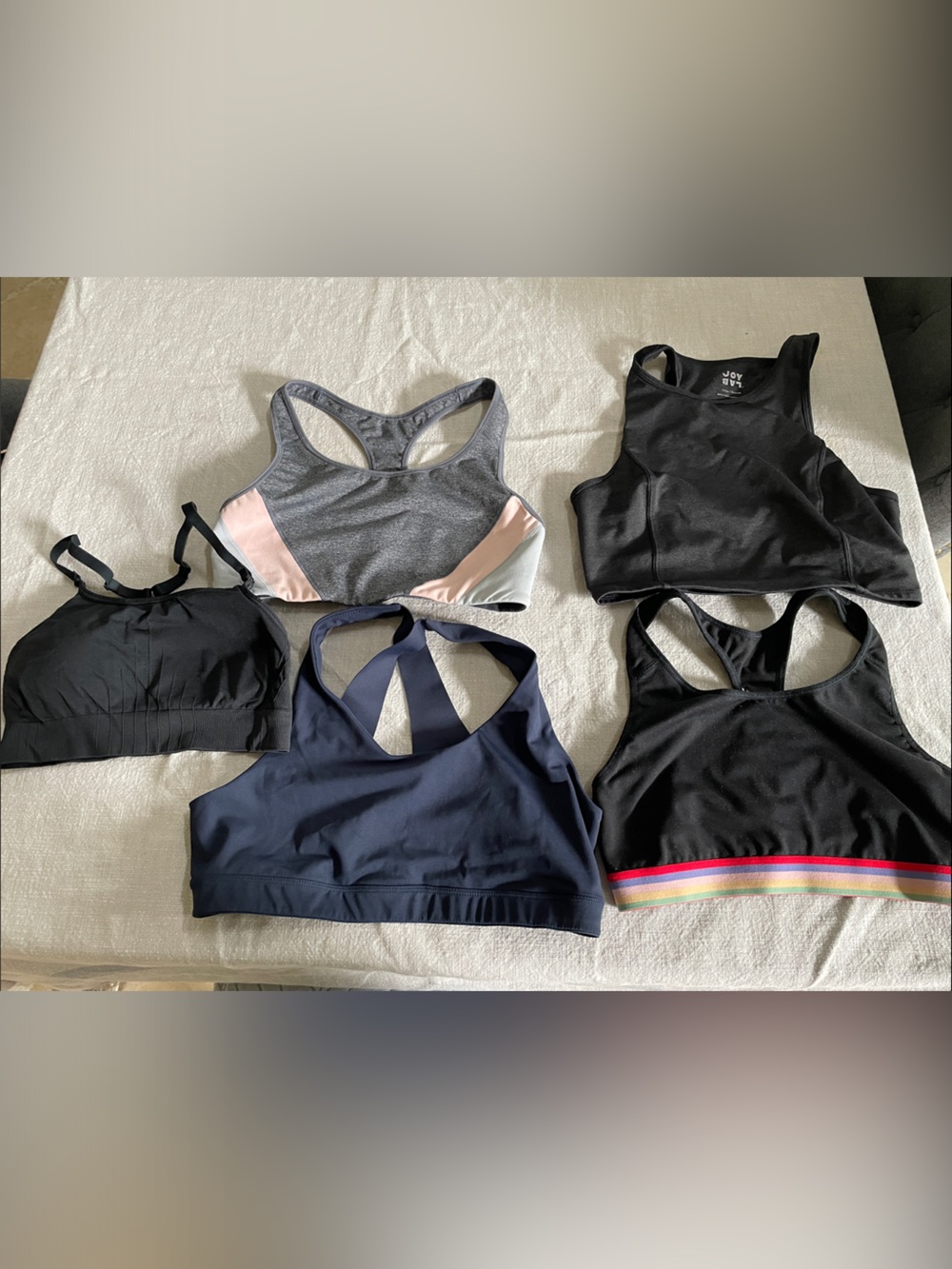 Bundle of womens large sports bras in Black, Navy, Gray and Pink
